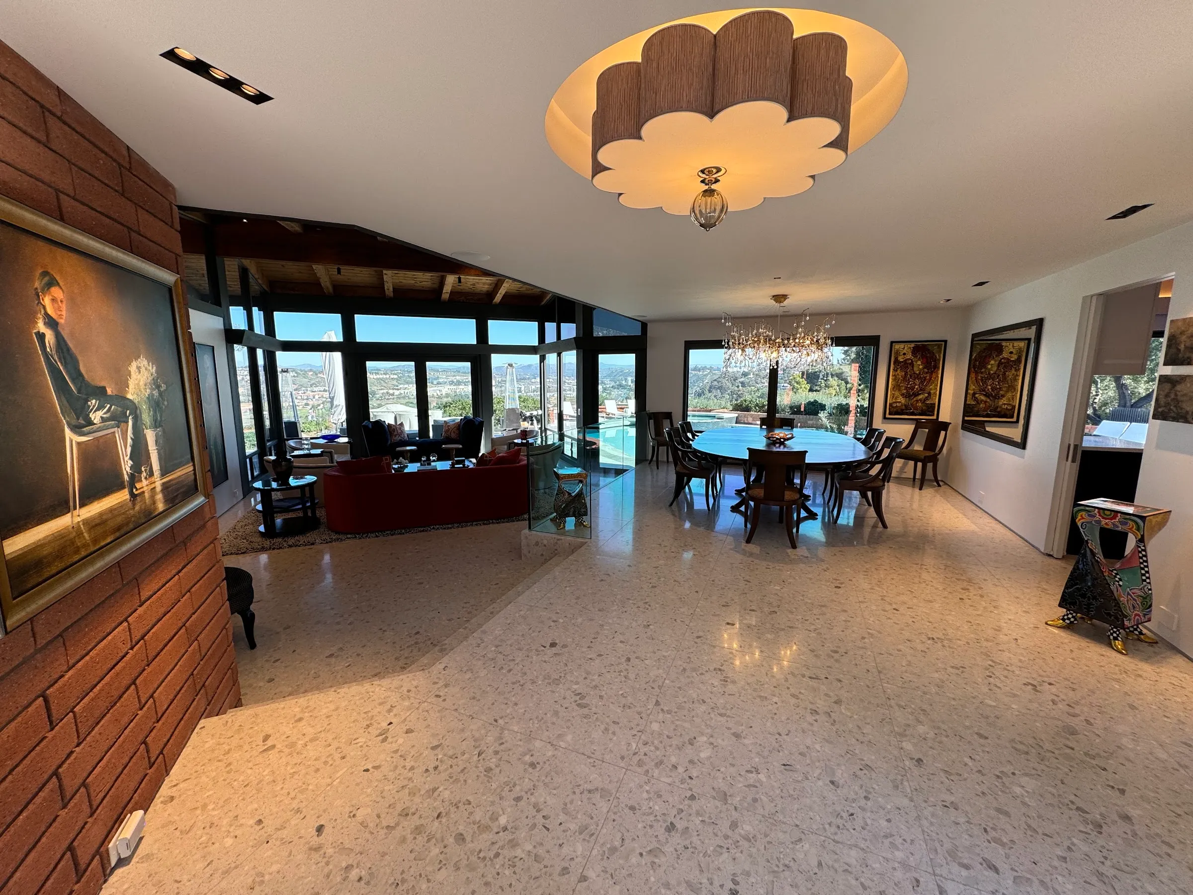 A great room with a statement chandelier